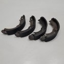NISSAN SUNNY CHERRY SZCZĘKI HAMULCOWE KOMPLET ABE C01001ABE